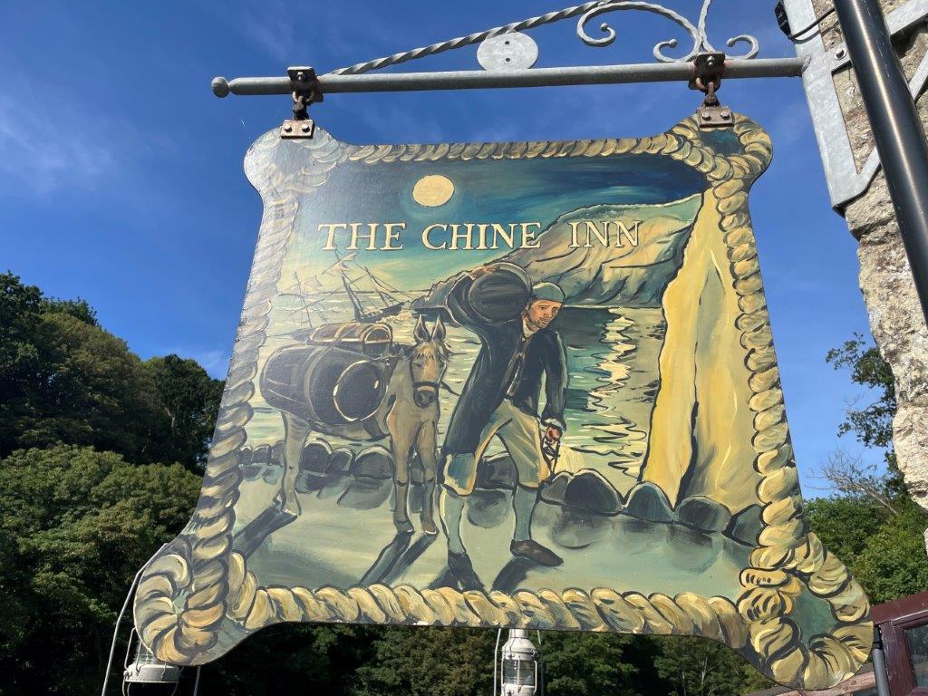 Lot: 98 - SEAFRONT PUBLIC HOUSE WITH STUNNING VIEWS AND OWNER/MANAGER LIVING ACCOMMODATION OVER - The hanging pub sign